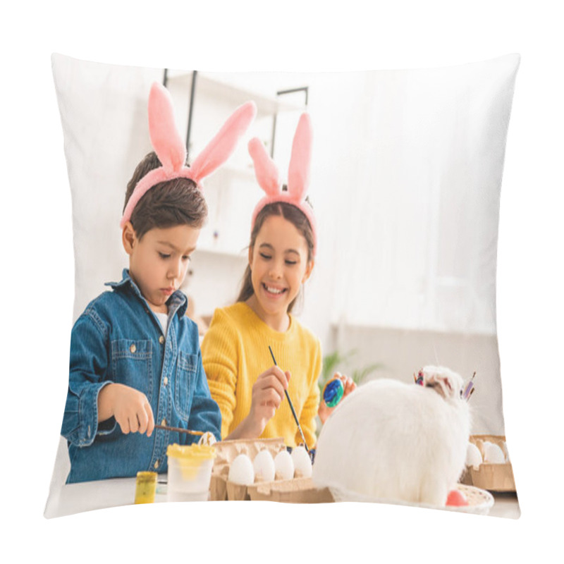 Personality  Cheerful Kids In Bunny Ears Painting Easter Eggs While Sitting At Desk Near White Rabbit In Wicker Pillow Covers