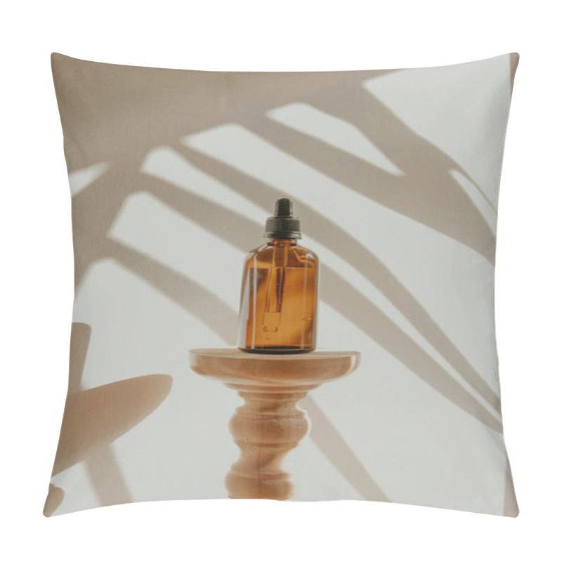 Personality  An Amber Glass Bottle On A Wooden Stand, With Soft Shadows From Leaves In The Background. Pillow Covers