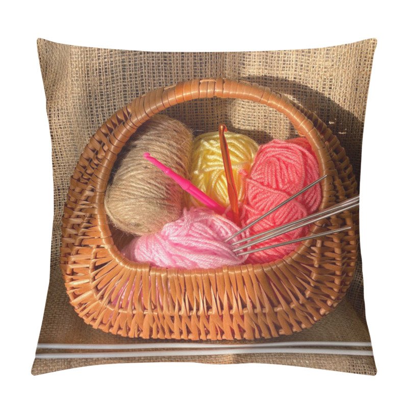 Personality  Needles In Thread For Knitting In A Basket. Woolen Threads For Needlework. Basket With Threads And Knitting Needles On A Brown Background. Pillow Covers