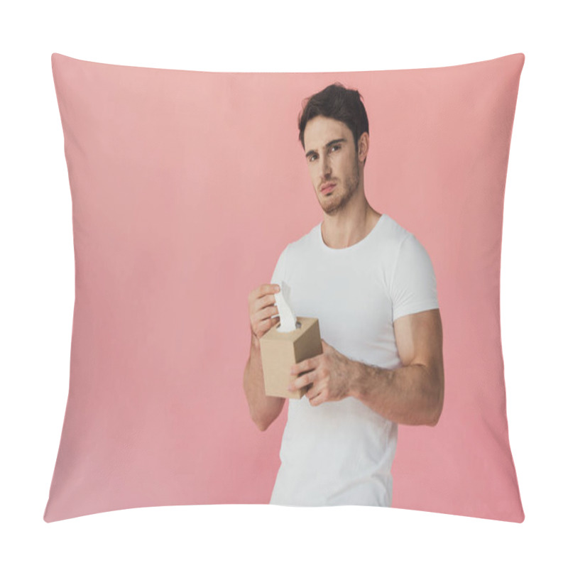 Personality  Displeased Muscular Man In White T-shirt Holding Napkins And Looking At Camera Isolated On Pink Pillow Covers