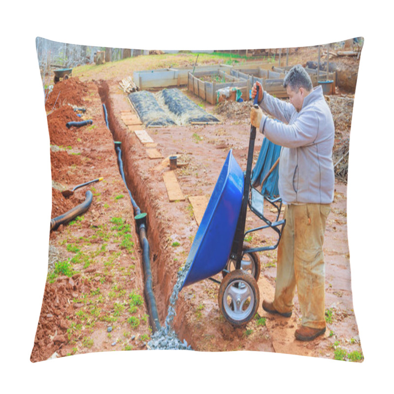 Personality  Using Wheelbarrow, Worker Fills Over Drainage Pipes With Crushed Stone Pillow Covers