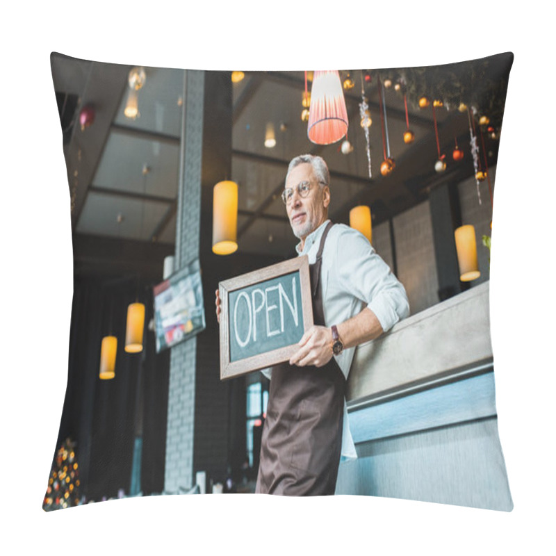 Personality  Senior Worker Of Pub Holding Open Sign And Standing Near Bar Counter  Pillow Covers