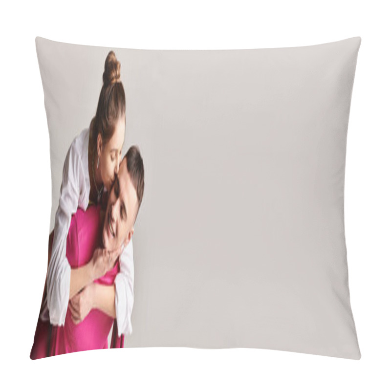 Personality  A Young Man Holds A Woman In His Arms, Both Looking Lovingly At Each Other, In A Stylish Studio Setting With A Grey Background. Pillow Covers