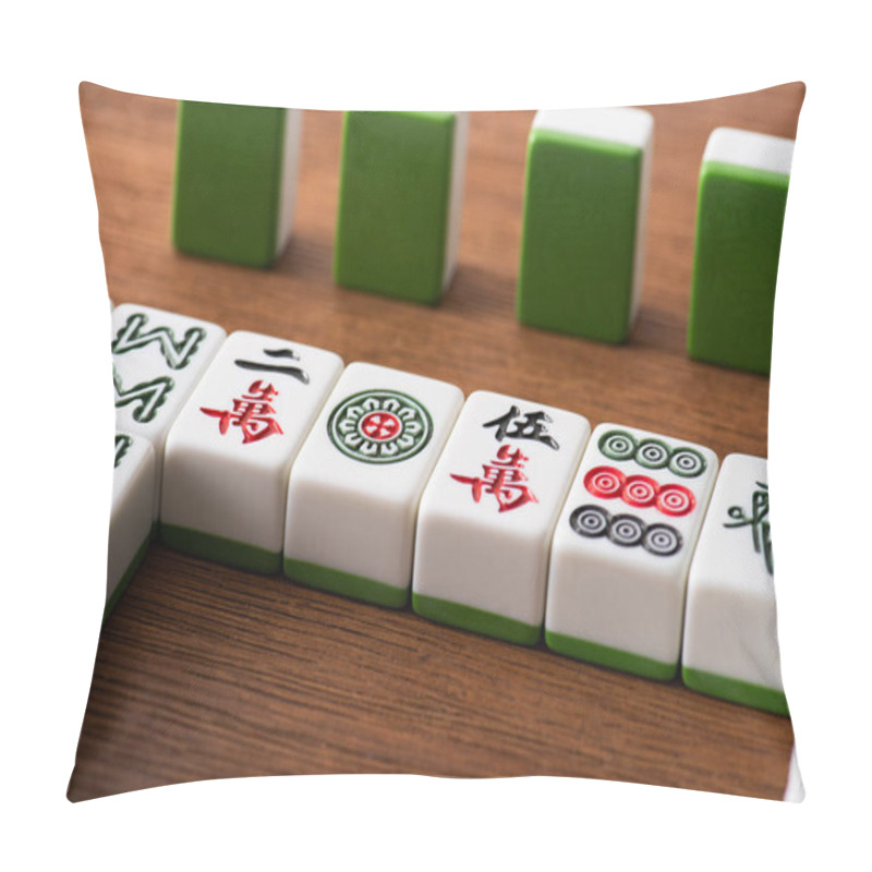 Personality  KYIV, UKRAINE - JANUARY 30, 2019: Selective Focus Of Mahjong Game Tiles Rows On Wooden Table Pillow Covers