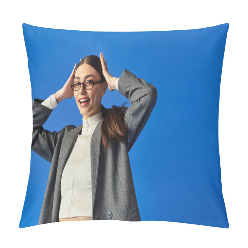 Personality  A Young Woman In A Chic Outfit Playfully Interacts Against A Blue Backdrop. Pillow Covers