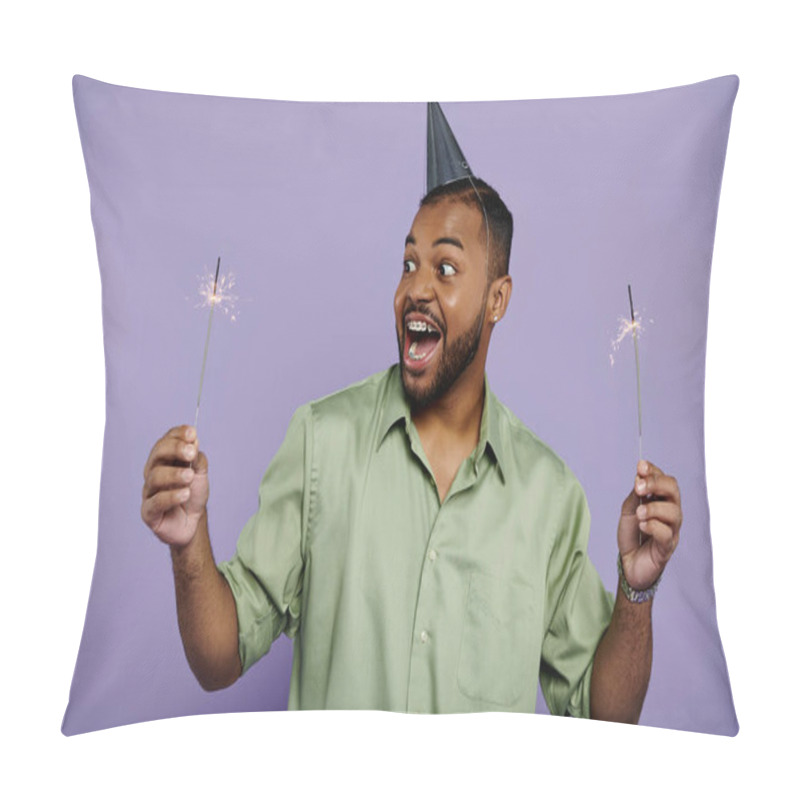 Personality  Young African American Man With Braces, Smiling, Holds Two Sparklers In Party Hat Against Vibrant Purple Background. Pillow Covers