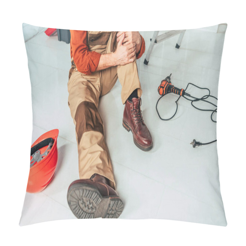 Personality  Cropped View Of Repairman Sitting On Floor And Holding Injured Knee In Office Pillow Covers