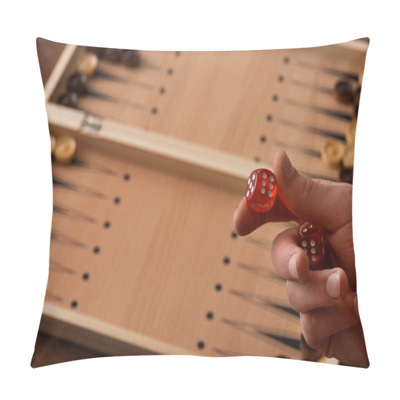 Personality  KYIV, UKRAINE - JANUARY 30, 2019: Cropped View Of Man Holding Dice Pair Near Backgammon Board With Checkers Pillow Covers