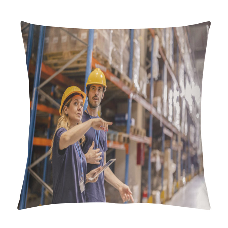 Personality  Two Warehouse Workers In Safety Gear Discussing Operations And Reviewing Inventory On A Tablet In A Warehouse Aisle. Pillow Covers