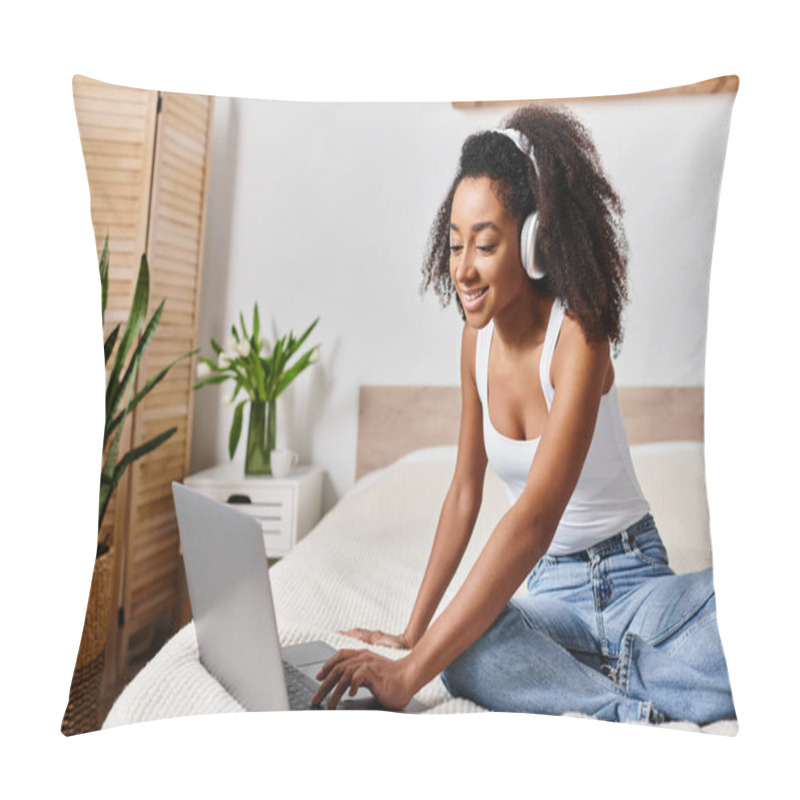 Personality  Curly African American Woman In A Tank Top, Sitting On A Bed, Intensely Focused On Using A Laptop Computer In A Modern Bedroom. Pillow Covers