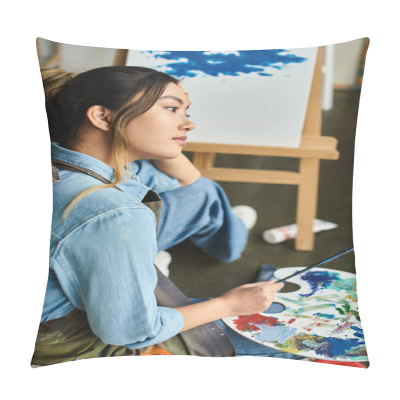 Personality  Woman In Blue Apron Holds Paintbrush In Workshop, Lost In Thought Over Her Painting. Pillow Covers