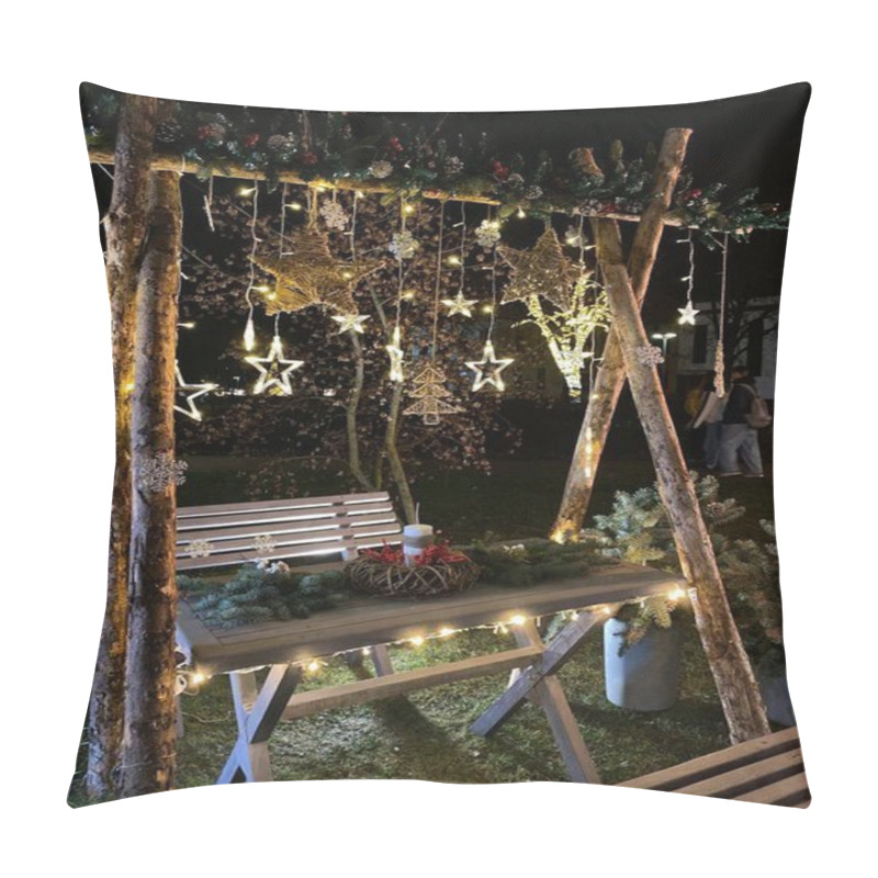 Personality  The Photo Features A Festive Outdoor Setup For A Christmas Celebration. The Scene Includes A Wooden Bench And Table Adorned With Various Decorations. Above The Table, A Wooden Frame Is Decorated With Hanging Star-shaped Lights And Other Ornaments, In Pillow Covers