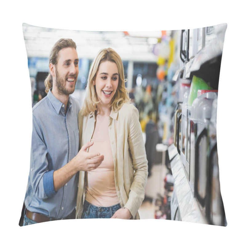 Personality  Smiling Consultant Pointing With Finger At Microwave And Talking With Woman In Home Appliance Store  Pillow Covers