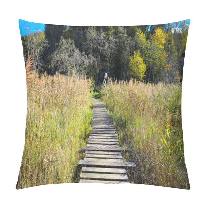 Personality  A Rustic Wooden Boardwalk Leading Through Autumn Wetlands With Tall Reeds And A Border Marker In The Background. Pillow Covers