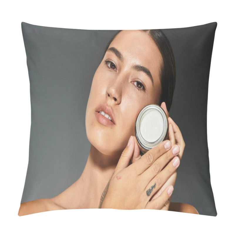 Personality  A Woman Gently Holds A Skincare Jar While Highlighting Her Glowing Complexion In Warm Lighting. Pillow Covers