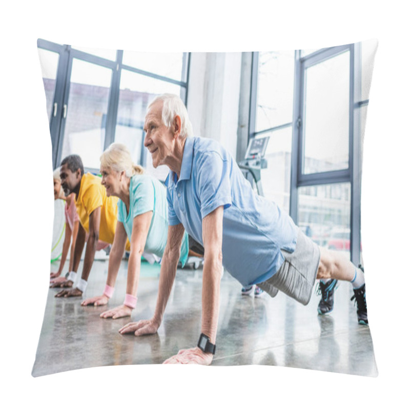 Personality  Selective Focus Of Multiethnic Senior Sportspeople Synchronous Doing Plank At Gym Pillow Covers