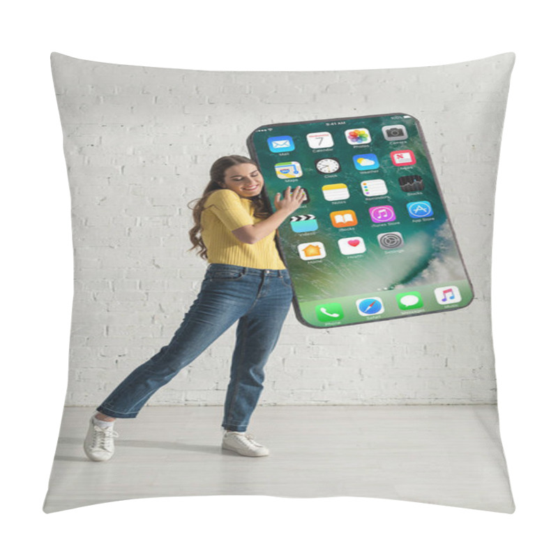 Personality  KYIV, UKRAINE - FEBRUARY 21, 2020: Young Smiling Woman Holding Big Model Of Smartphone With Iphone Screen At Home  Pillow Covers