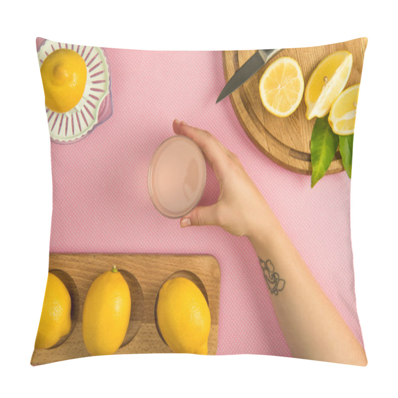 Personality  Top View Of Female Hand With Glass Of Lemon Juice On Pink Table With Squeezer And Lemons On Wooden Boards Pillow Covers