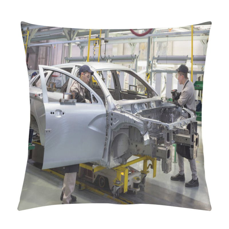 Personality  Russia, Izhevsk - December 14, 2019: LADA Automobile Plant Izhevsk. The Worker Is Putting The Door To A New Car. Pillow Covers