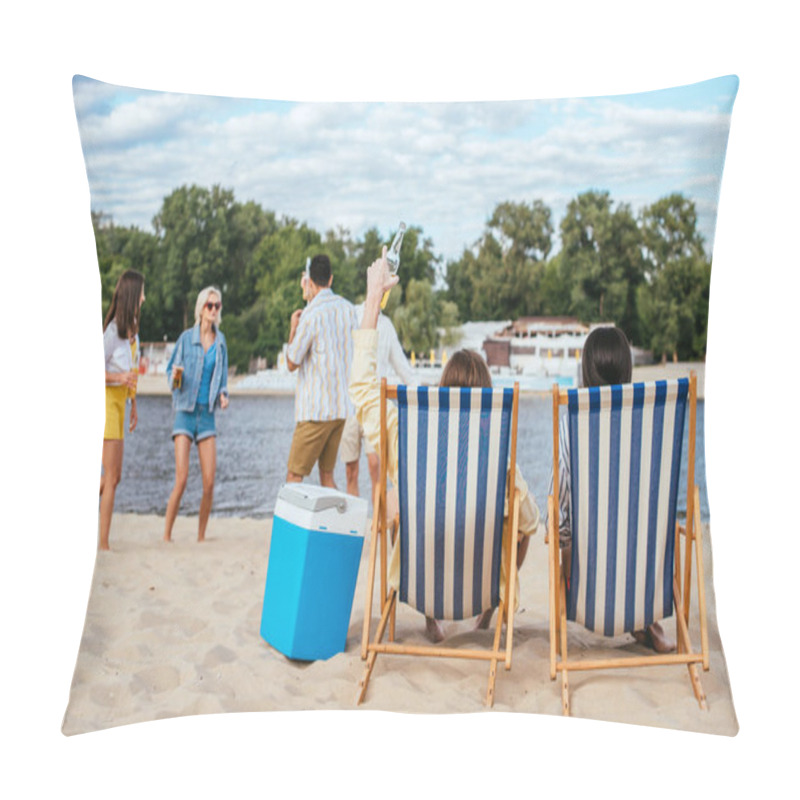 Personality  Back View Of Man And Woman Sitting In Chaise Lounges Near Multicultural Friends Having Fun On Beach Pillow Covers