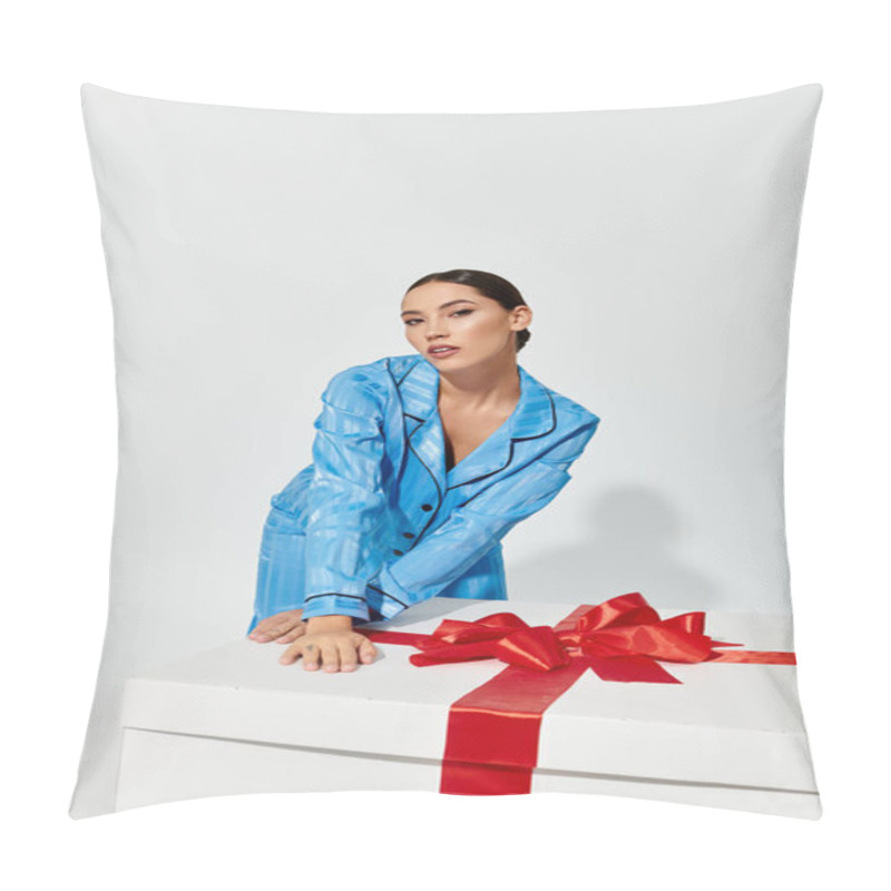 Personality  A Stylish Young Woman Engages With A Large Gift Box Adorned With A Bright Red Bow. Pillow Covers