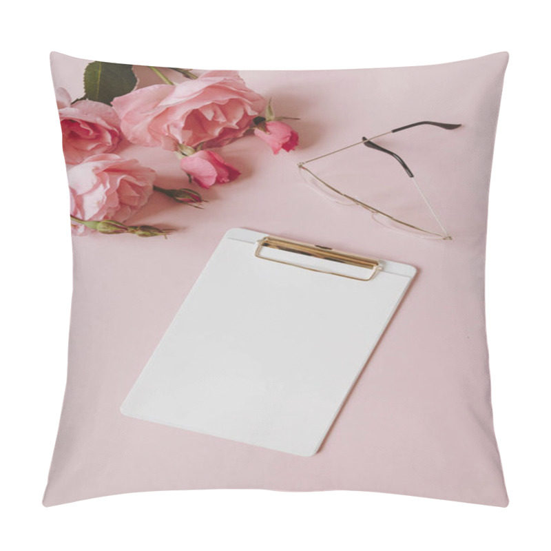 Personality  Blank Paper Sheet Clipboard Note Pad, Rose Flowers Bouquet, Glasses On Pink Background. Minimal Home Office Desk Table. Flat Lay, Top View. Pillow Covers