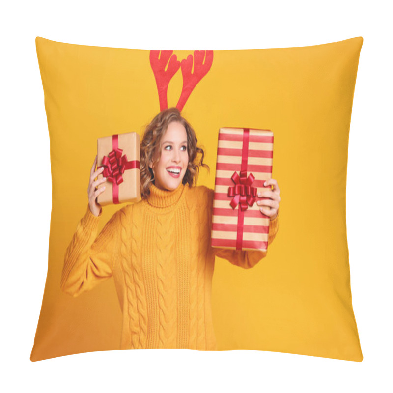 Personality  Happy Young Woman In Knitted Sweater With Red Deer Antlers  Showing Wrapped Gifts  And Looking Away With Smile On Christmas Day Against Yellow Backgroun Pillow Covers