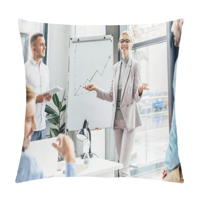 Personality  Smiling Young Businesswoman Standing Near Whiteboard And Looking At Male Colleagues In Office Pillow Covers