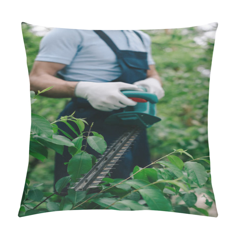 Personality  Selective Focus Of Gardener Pruning Bush With Electric Trimmer In Park Pillow Covers