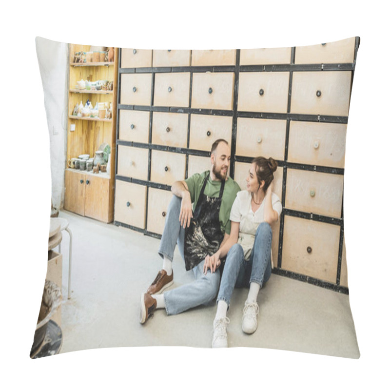 Personality  Cheerful Couple Of Potters In Aprons Holding Hands While Sitting Near Cupboard In Ceramic Studio Pillow Covers