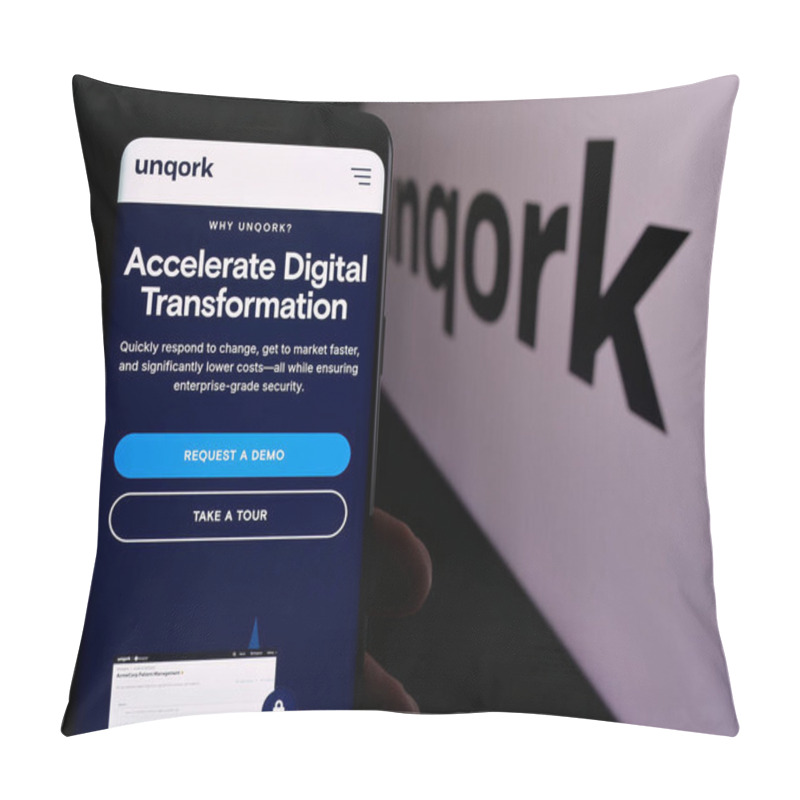 Personality  Stuttgart, Germany - 08-25-2024: Person Holding Smartphone With Web Page Of US Enterprise Application Platform Company Unqork Inc. With Logo. Focus On Center Of Phone Display. Pillow Covers