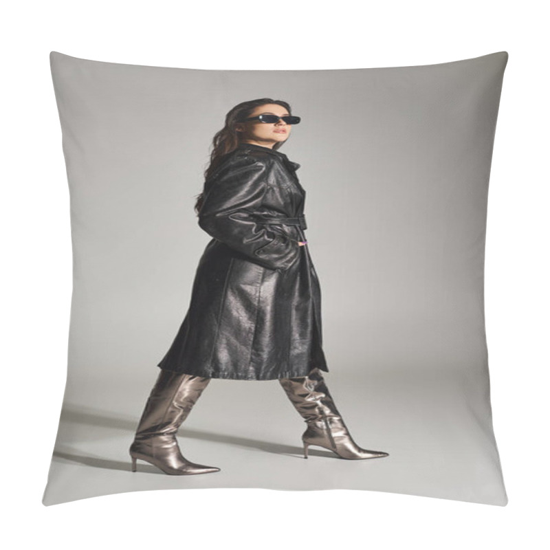 Personality  Elegant Plus-size Woman Strutting Confidently In A Black Leather Coat And Boots Against A Striking Gray Background. Pillow Covers