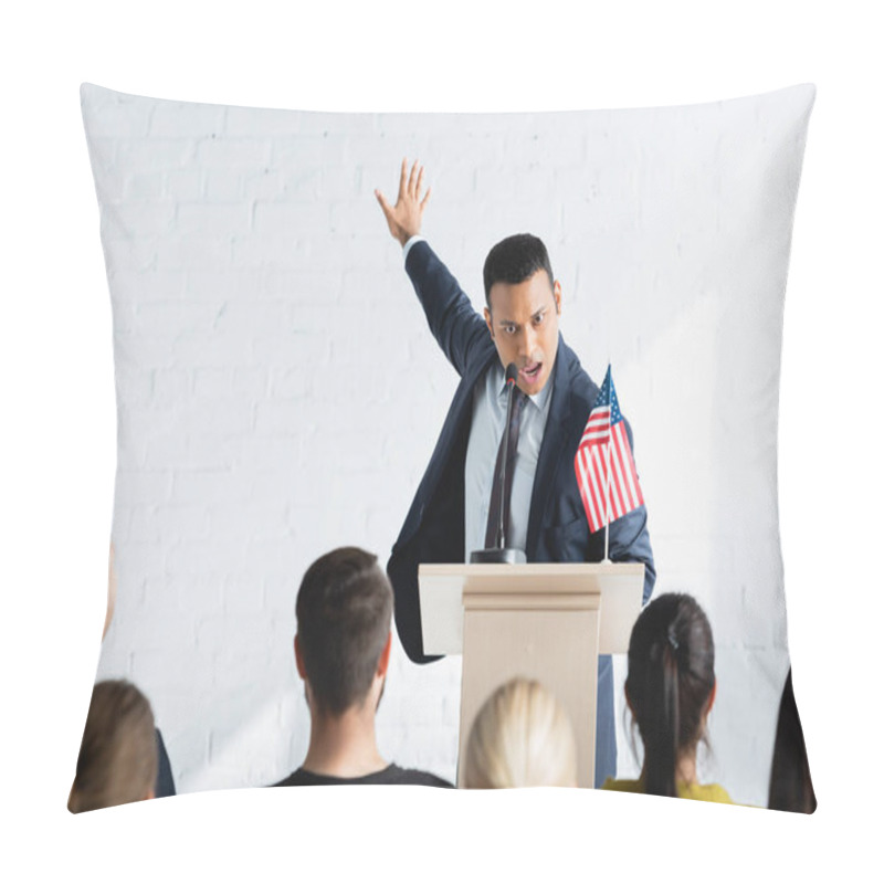 Personality  Excited Indian Agitator Gesturing While Talking To Voters In Conference Hall, Blurred Foreground Pillow Covers