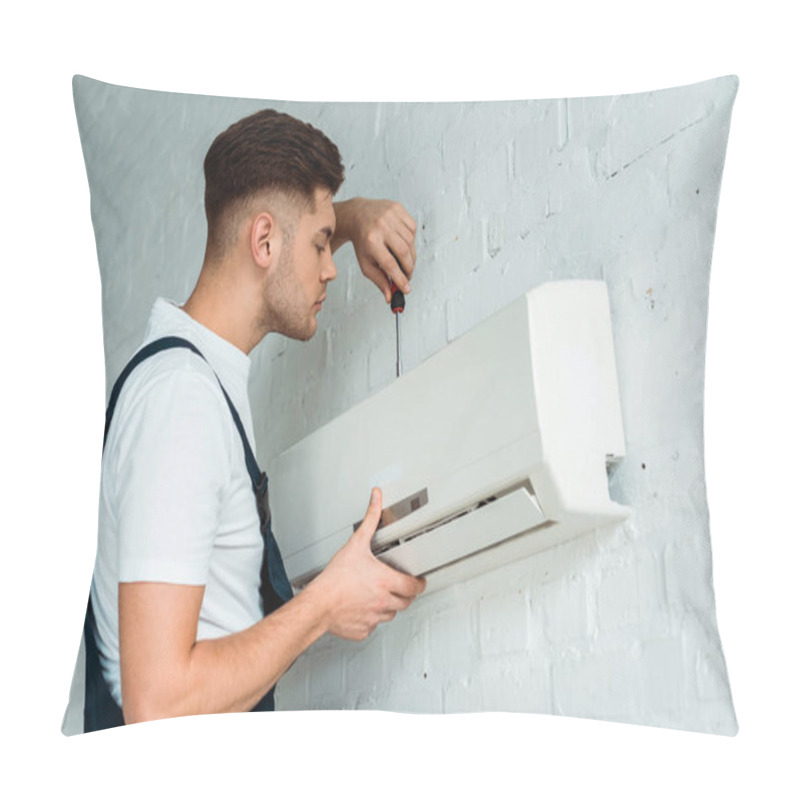 Personality  Handsome Installer Holding Screwdriver While Installing Air Conditioner  Pillow Covers