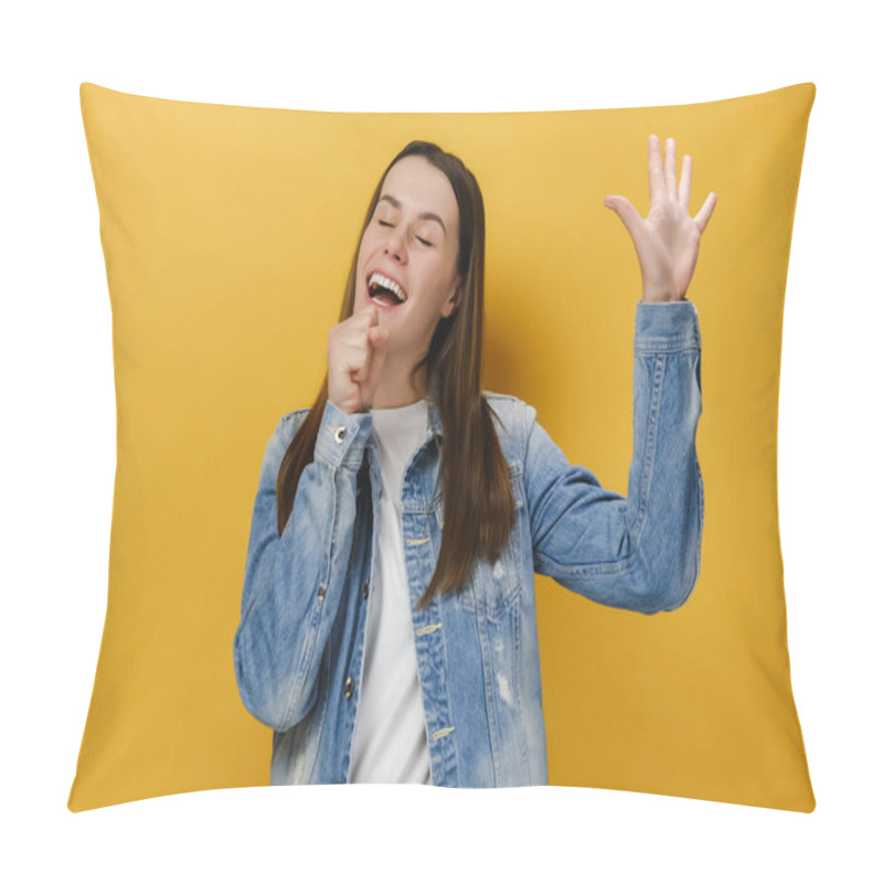 Personality  Carefree Joyful Millennial Woman Sings Favorite Song, Holds Hand As Microphone Near Mouth, Raises Palm, Feels Relaxed And Entertained, Enjoys Moment, Wears Denim Jacket, Isolated On Yellow Background Pillow Covers