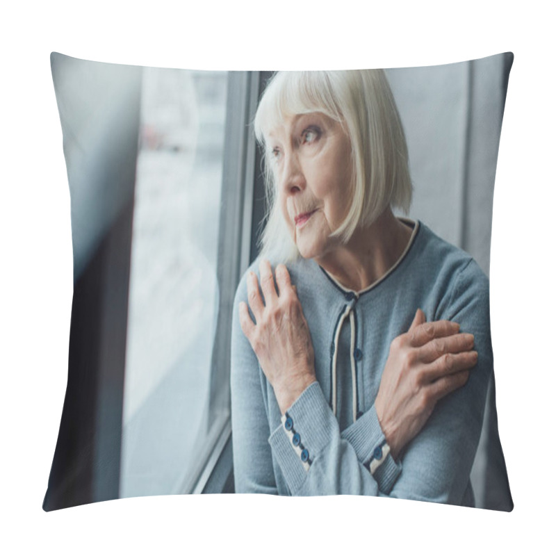 Personality  Pensive Senior Woman With Hands Crossed Looking Through Window At Home  Pillow Covers