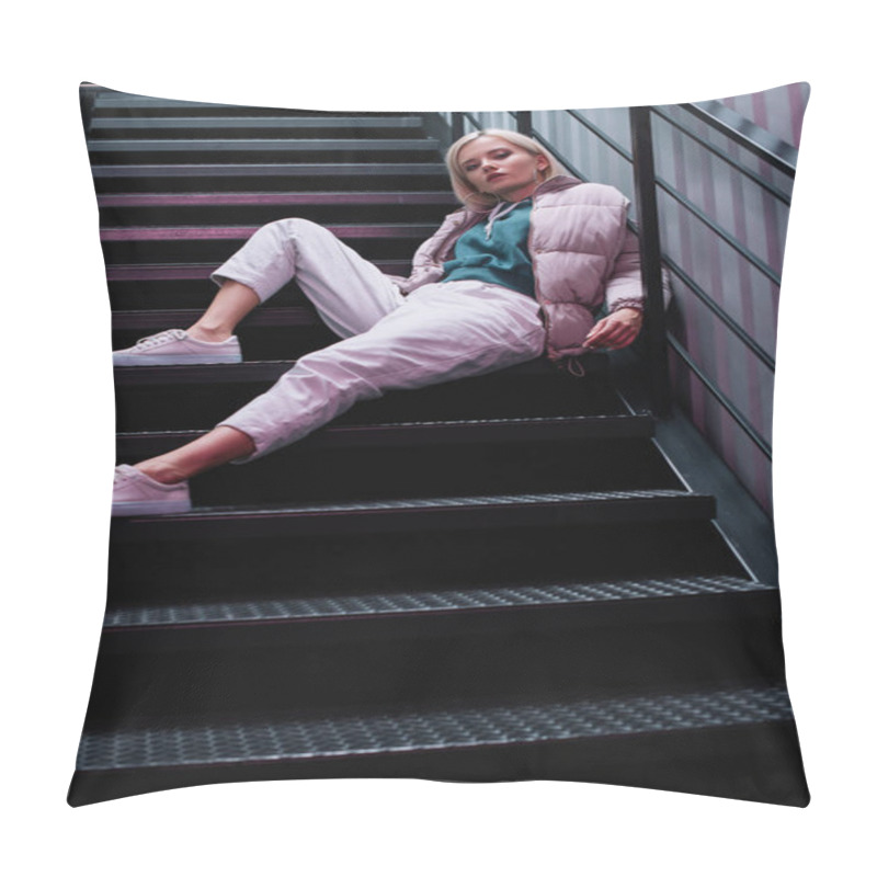 Personality  Blonde Girl In Down Jacket And Sneakers Sitting On Stairs And Looking At Camera Pillow Covers