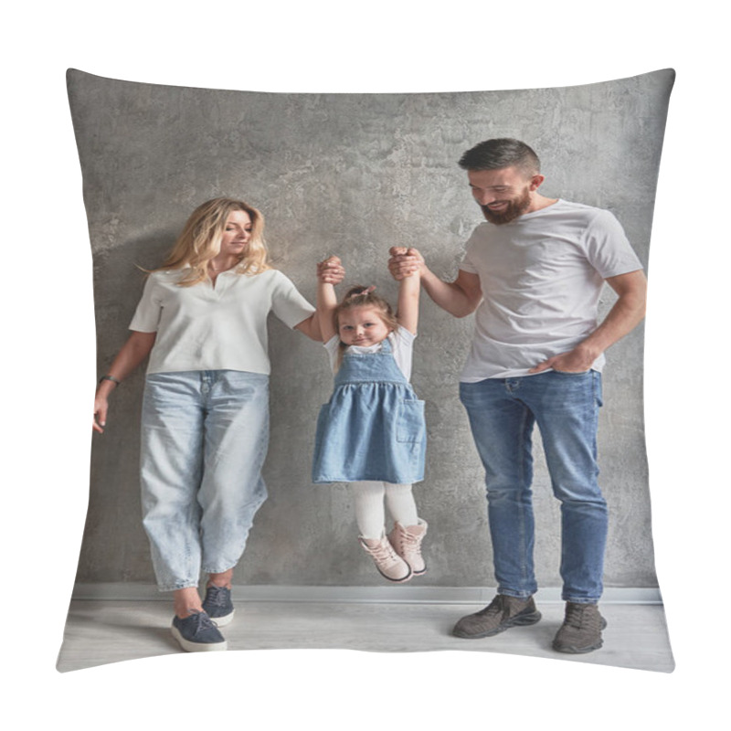 Personality  Full Length Of Happy Family With Child Standing Against The Wall In Newly Built Apartment. Woman And Man Holding Hands Of Adorable Daughter And Lifting Kid In The Air In New Home. Pillow Covers