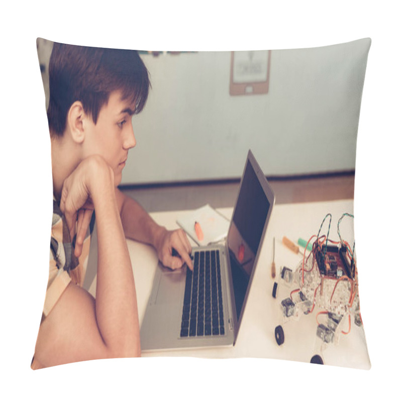 Personality  Upset Teenager In Shirt Programming Robot At Home. Young Man In Shirt. Using Laptop. Modern Hobby Concept. Modern Technology. Robot Engineering Concept. Innovation For Fun. Teenager With Robor. Pillow Covers