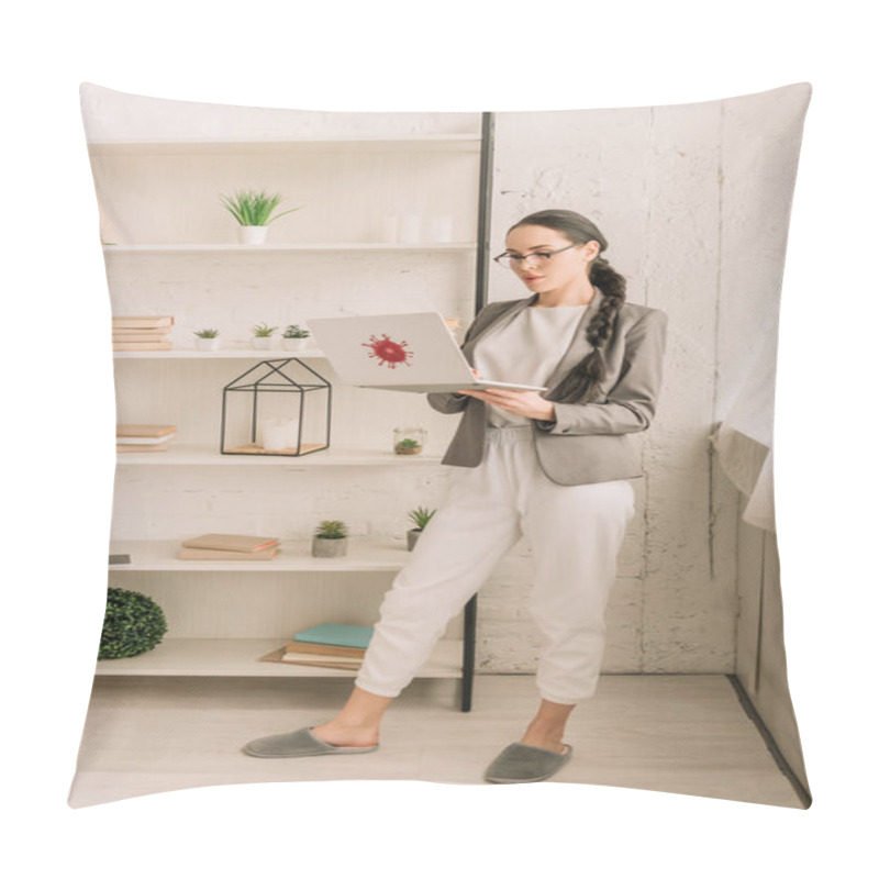 Personality  Young Businesswoman In Blazer Over Pajamas Using Laptop With Coronavirus Bacteria Sticker While Standing Near Rack With Books And Plants Pillow Covers