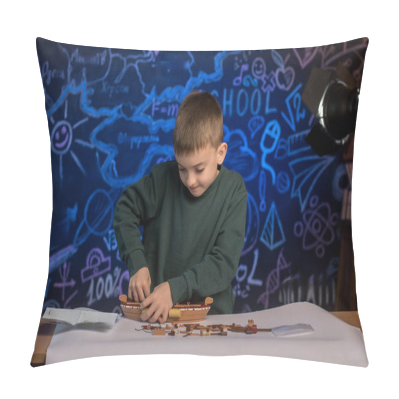 Personality  Boy Working On A Model Ship With An Instructional Manual, Engaging In A Hands-on Activity That Encourages Learning, Focus, And Patience Pillow Covers