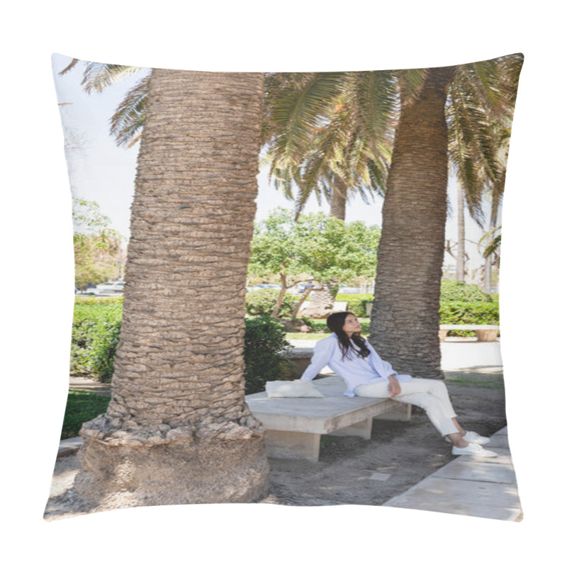 Personality  Full Length View Of Woman Sitting On Bench In Park Under Giant Palms Pillow Covers