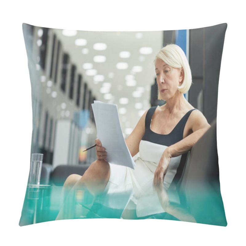 Personality  Mature Serious Businesswoman With Short Hair Sitting On Sofa And Reading Documents Before Business Meeting Pillow Covers