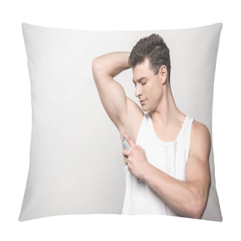 Personality  Young Man In White Sleeveless Shirt Applying Deodorant On Underarm Isolated On Grey Pillow Covers