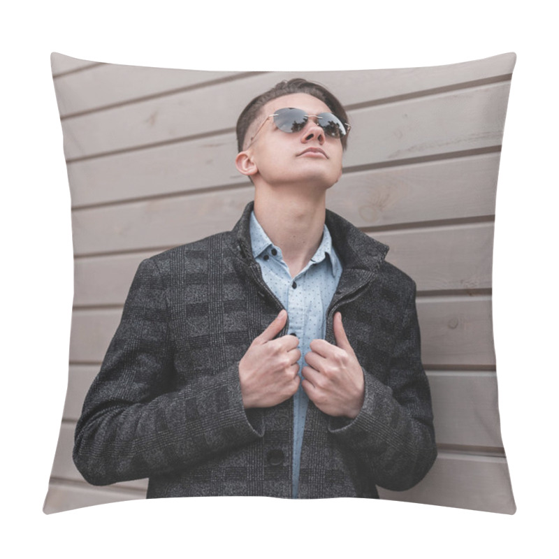 Personality  Handsome Young Hipster Man With Stylish Hairstyle In Trendy Dark Sunglasses In An Elegant Gray Jacket In A Vintage Shirt Enjoys A Spring Day Near A Wooden Building. Modern Guy Model Relaxes Outdoors. Pillow Covers