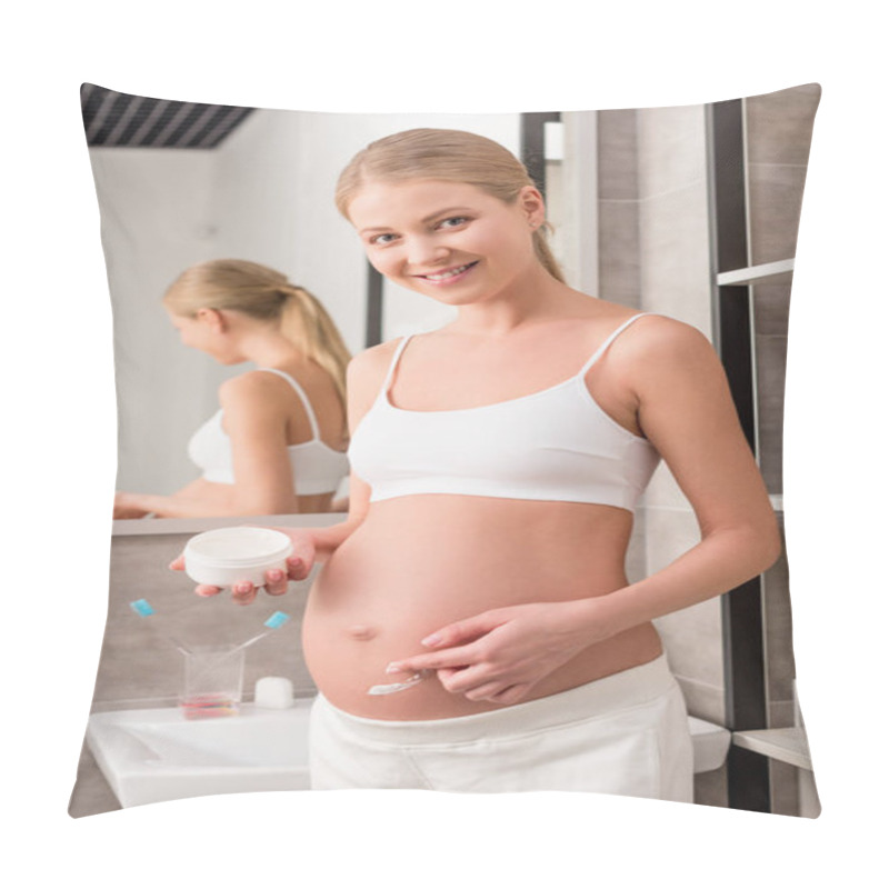 Personality  Happy Pregnant Woman Applying Cream On Tummy To Avoid Stretch Marks And Looking At Camera In Bathroom Pillow Covers