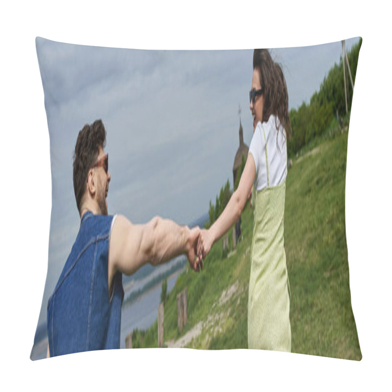 Personality  Side View Of Cheerful Brunette Woman In Sunglasses And Stylish Sundress Holding Hand Of Bearded Boyfriend While Running On Grassy Hill, Countryside Wanderlust And Love Concept, Banner  Pillow Covers