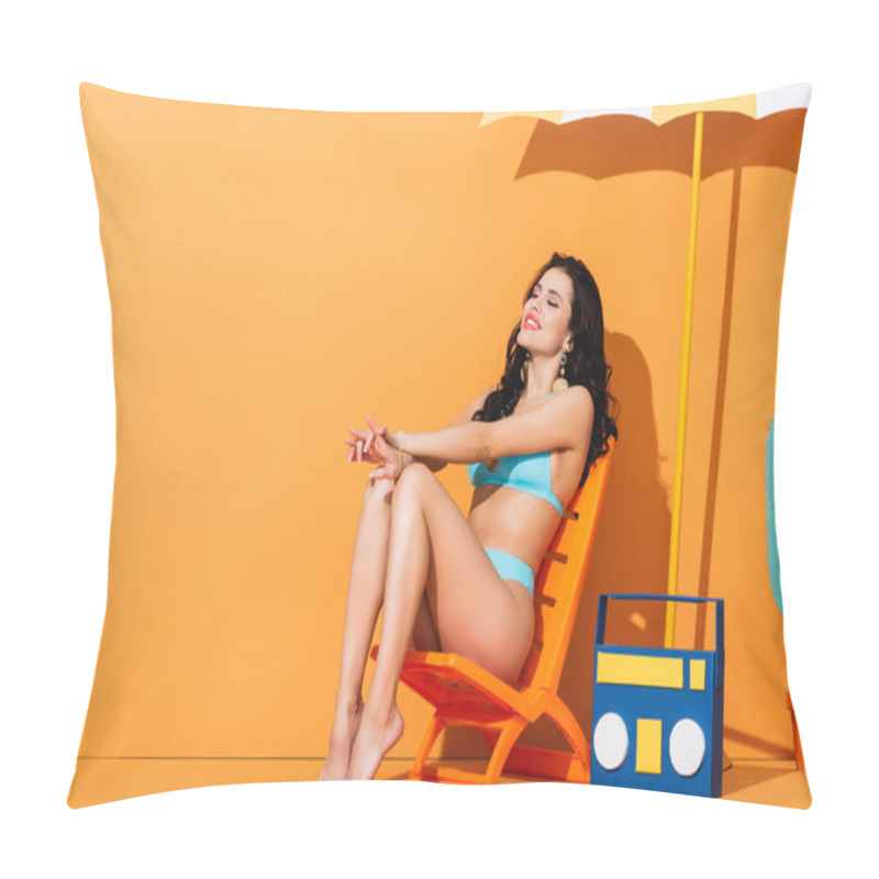 Personality  Happy Young Woman With Closed Eyes Sitting On Deck Chair Near Paper Boombox And Umbrella On Orange Pillow Covers