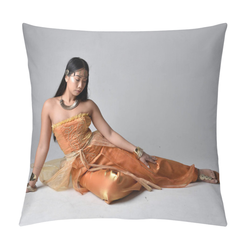 Personality  Full Length Portrait Of Pretty Young Asian Woman Wearing Golden Arabian Robes Like A Genie, Seated Pose, Isolated On Studio Background. Pillow Covers