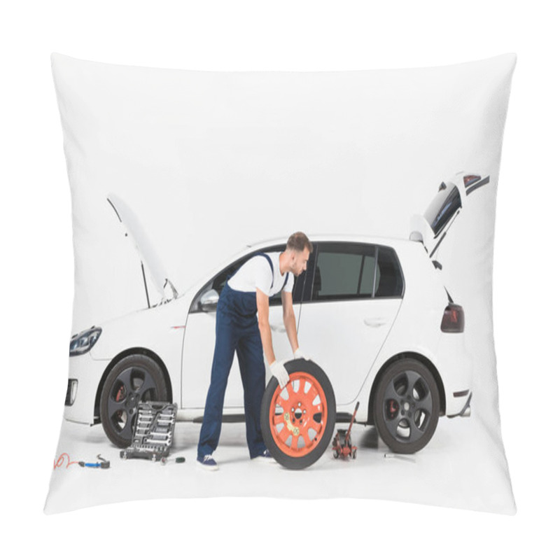 Personality  Side View Of Auto Mechanic In Blue Uniform Changing Car Tire On White Pillow Covers